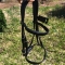 Black PVC horse tack bridles with soft padding on browband