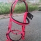 Hot pink horse bridle and rein with black soft padding